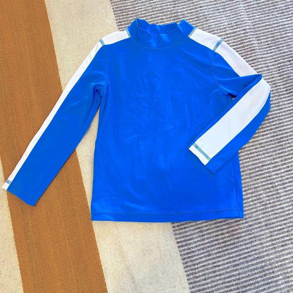 Boden, 5-6 rash guard in blue with white stripe on sleeves